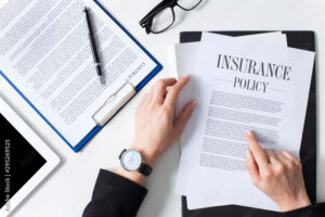 Business woman examining insurance policy